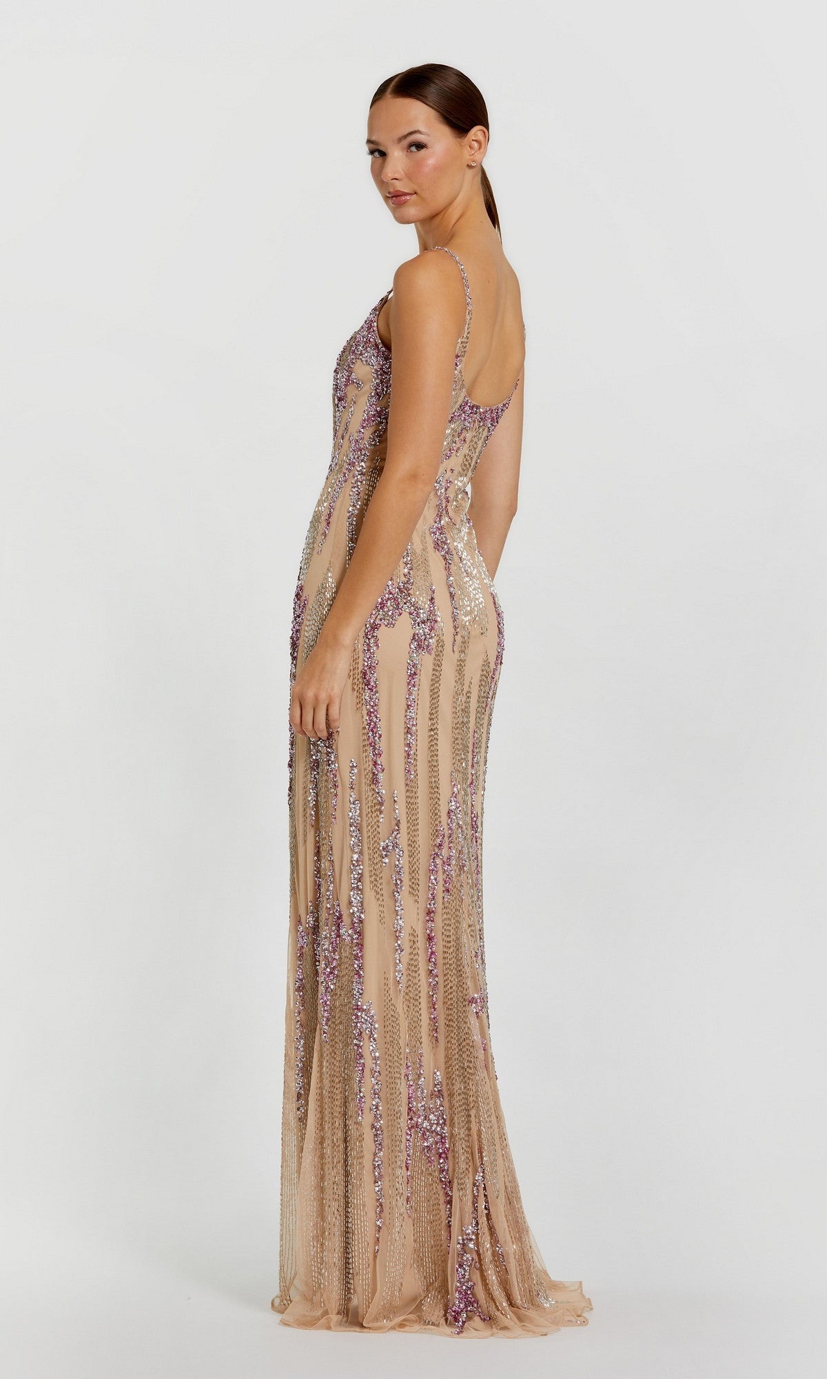 A woman stands in profile against a white background, wearing the Mac Duggal 6150 long formal dress adorned with purple and silver sequin embellishments.